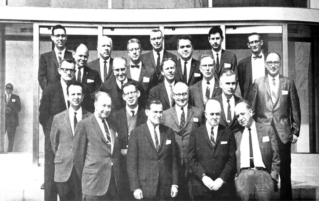 Authors and panel members: (front to back, left to right) H.H. Uhlig, M.G. Fontana, F.L. LaQue,  M.C. Bloom, (second row) Z.A. Foroulis, M. Cohen, T.P. Hoar, R.C. Carlston,  (third row) J.D. Sudbury, M. Pourbaix, D. Robertson, H.L. Logan, J.J: Harwood (forth row) T.P. May, H. Leidheiser Jr, , E.H. Phelps (fifth row) R.M. Hurd, F.W. Fink, R.T. Foley, H.T. Yolken.